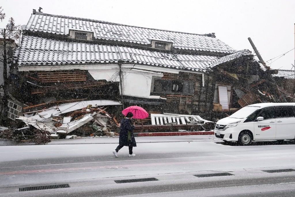 Japan’s PM vows ‘ceaseless’ aid as snow hampers quake relief