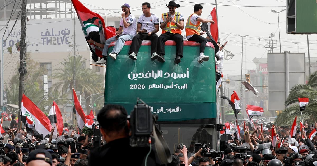 Thousands welcome Iraq’s football team home after World Cup qualifier