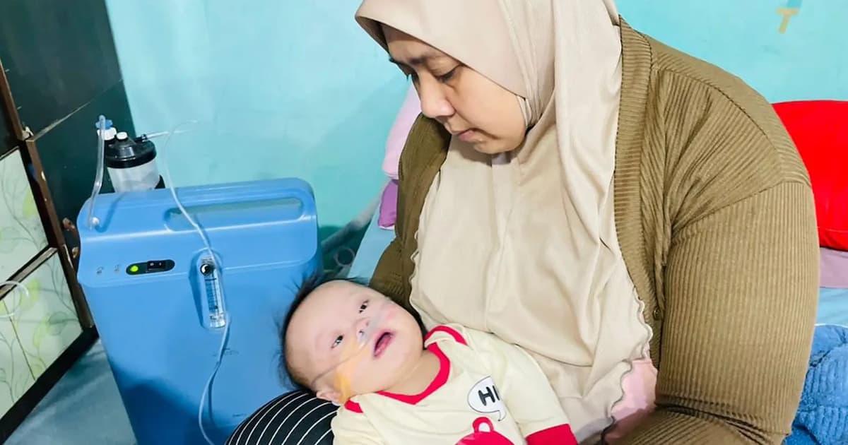 Every breath counts for baby Awang as his parents race against time