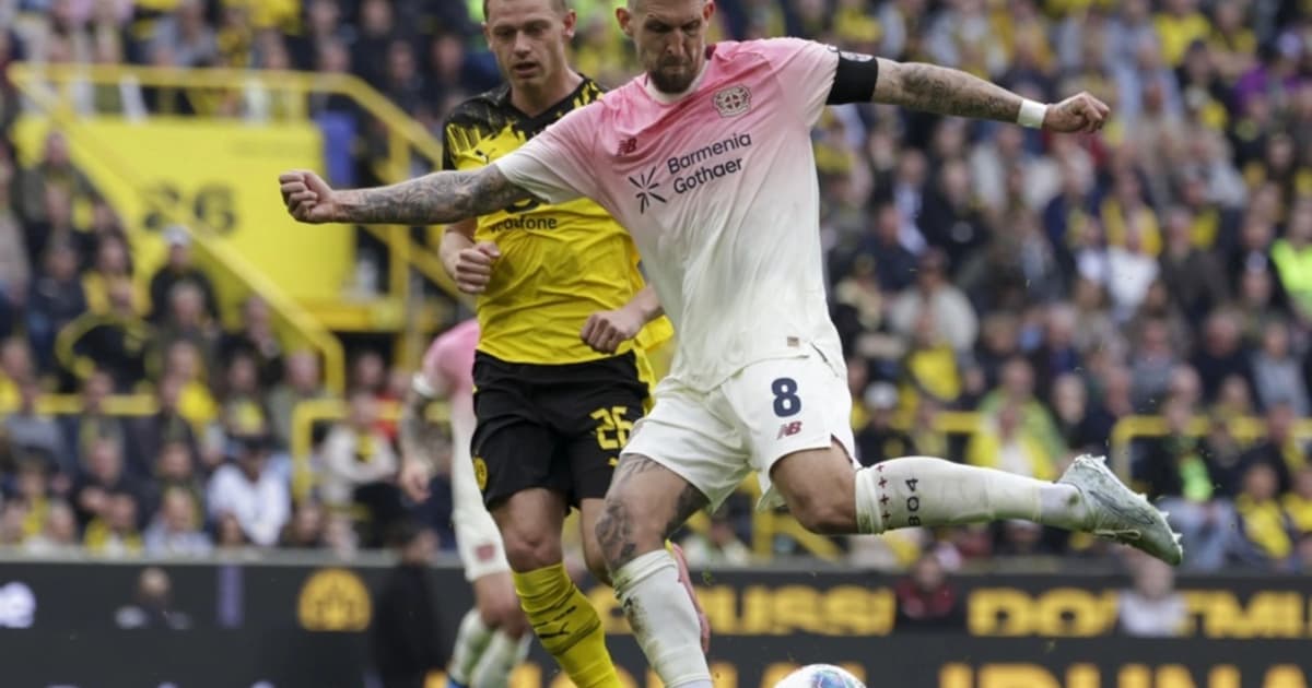 Leverkusen snatch 1-0 win at Dortmund to stay in Champions League contention