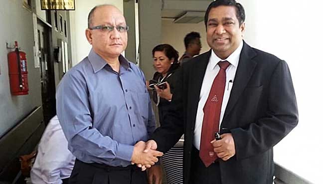 Asst Comm Abd Radzak Abd Ghani (left) with his lawyer Zahir Shah at the Kota Kinabalu High Court.