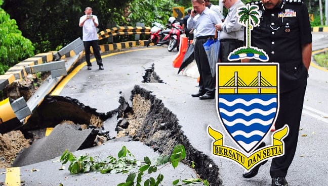 Penang road caves in during downpour