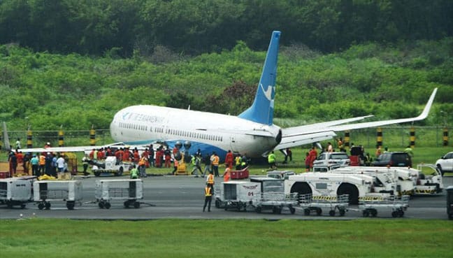 Chinese plane slides off Manila airport runway in heavy rain