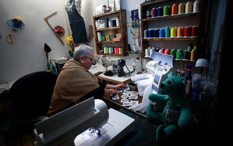 Tailor sews teddy bears from Covid victims’ clothes