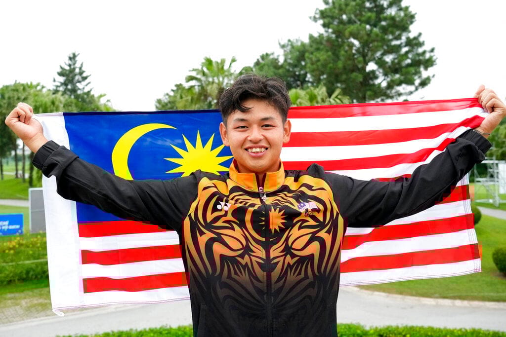 Ervin swings it right to win historic golf gold