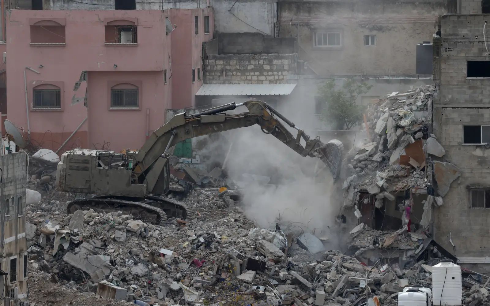 Israel begins demolishing 25 residential buildings in West Bank camp