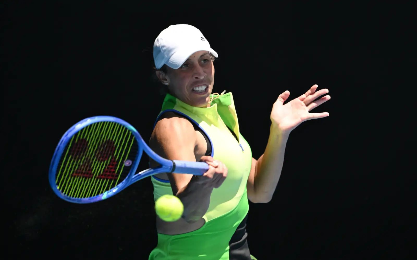 Defending champion Keys survives mid-set wobble to advance