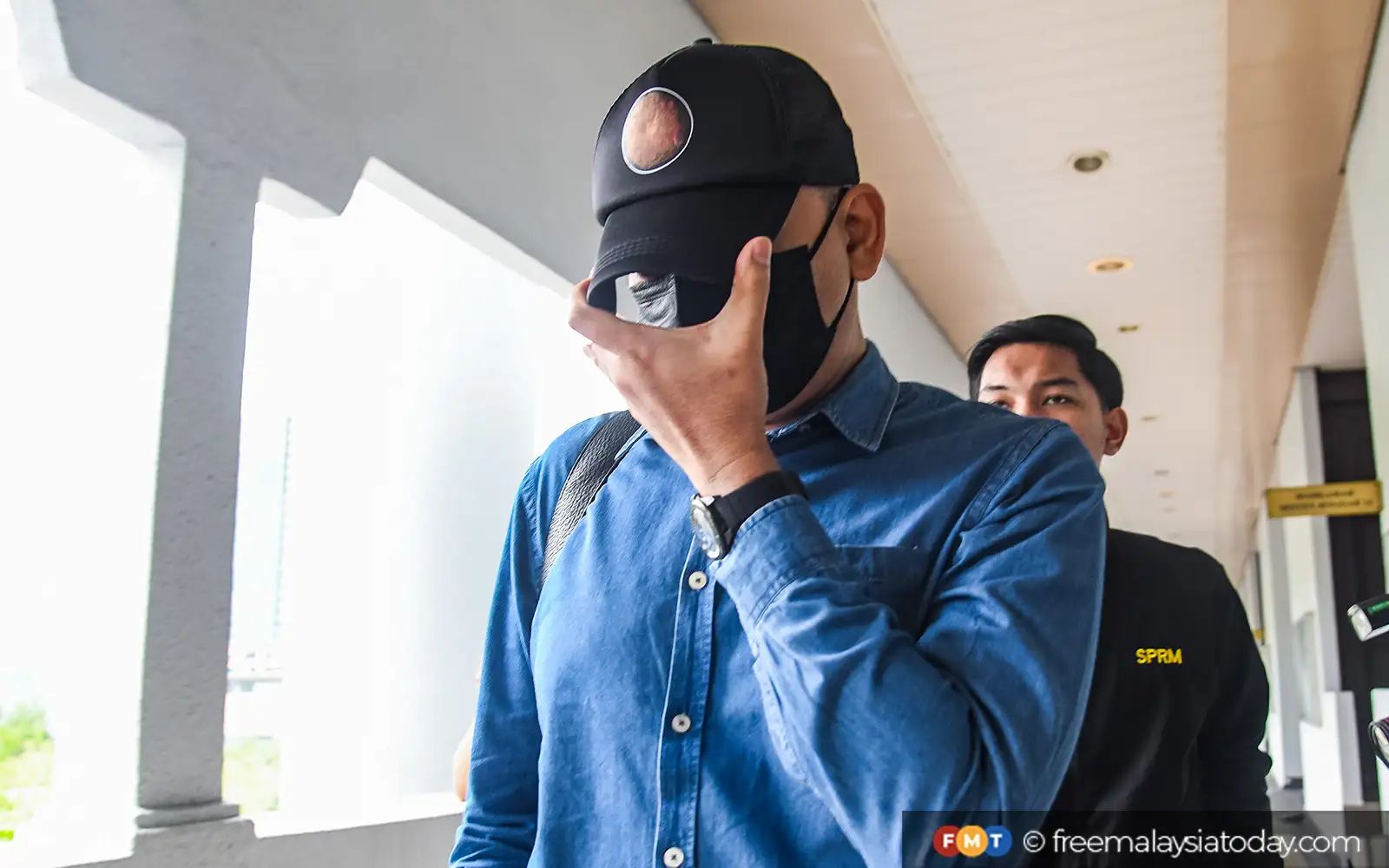 SSM deputy CEO claims trial to receiving cash from Hamzah Zainudin’s son