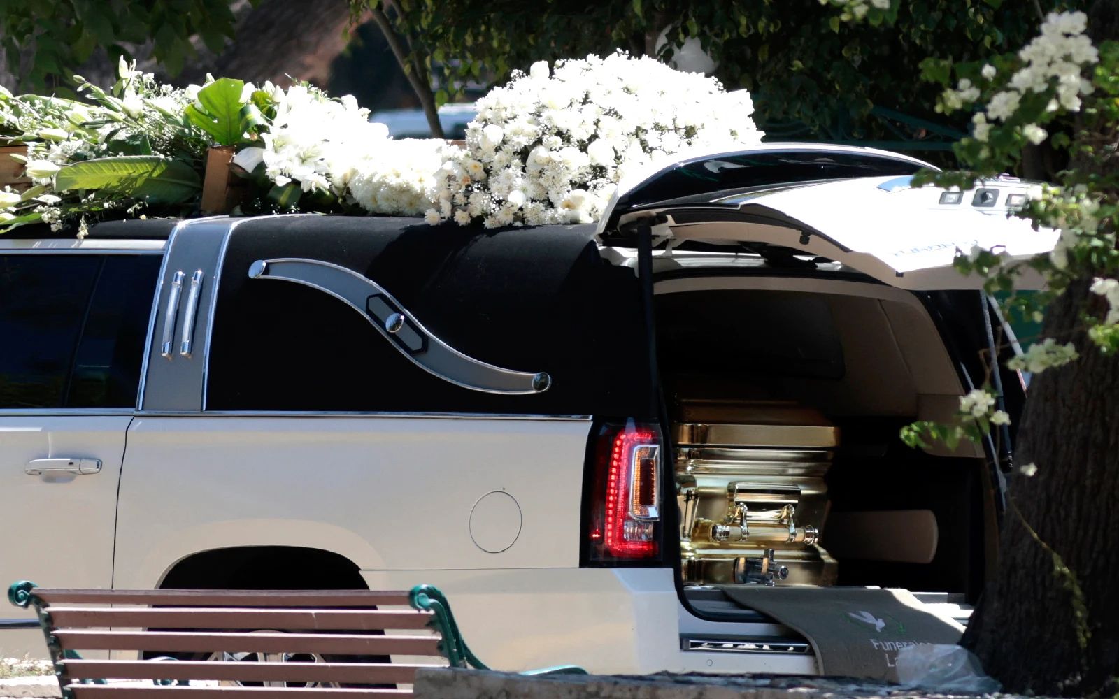 Flowers, music, and soldiers at funeral of drug lord