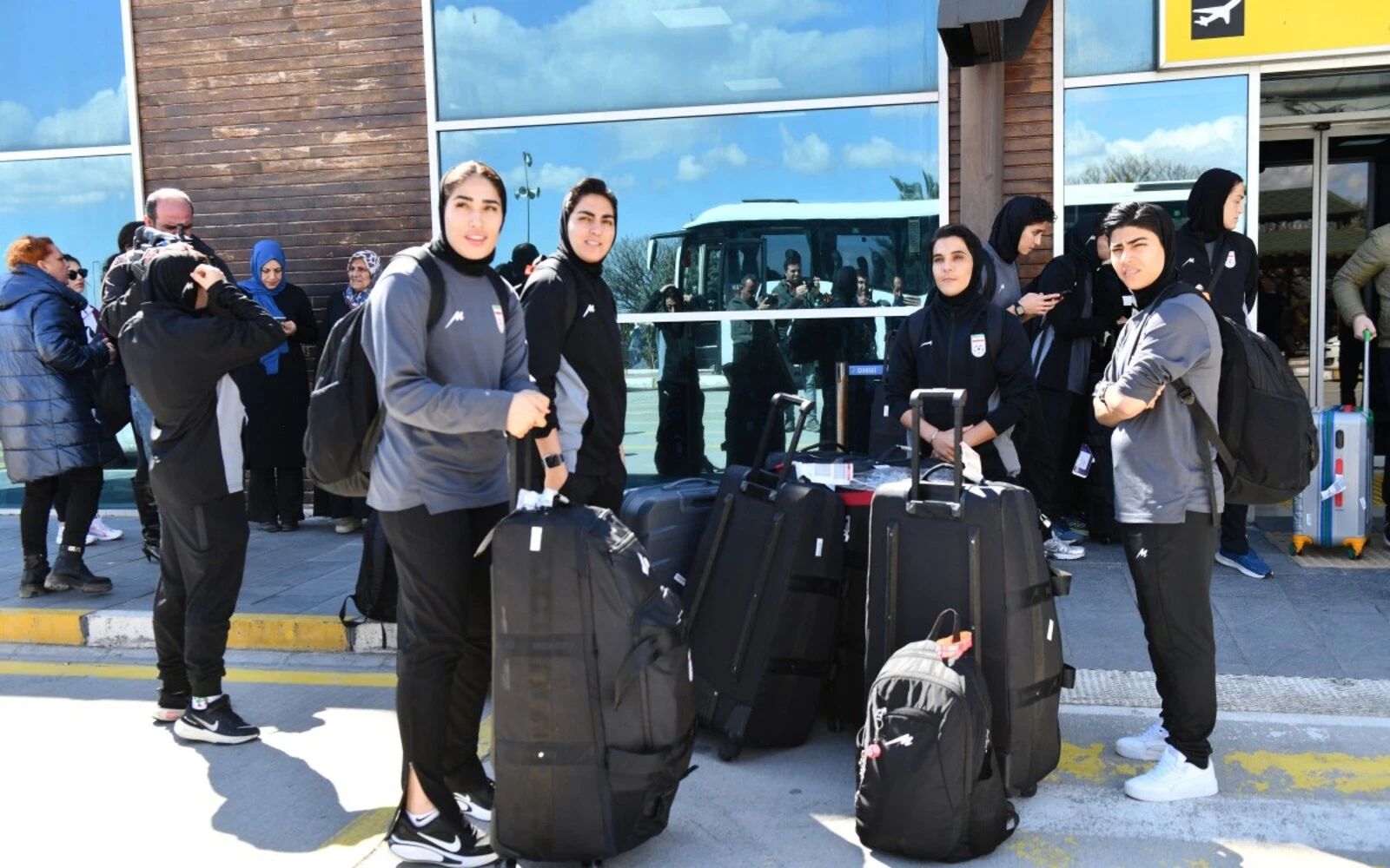 Iran welcomes women’s football team home after asylum controversy