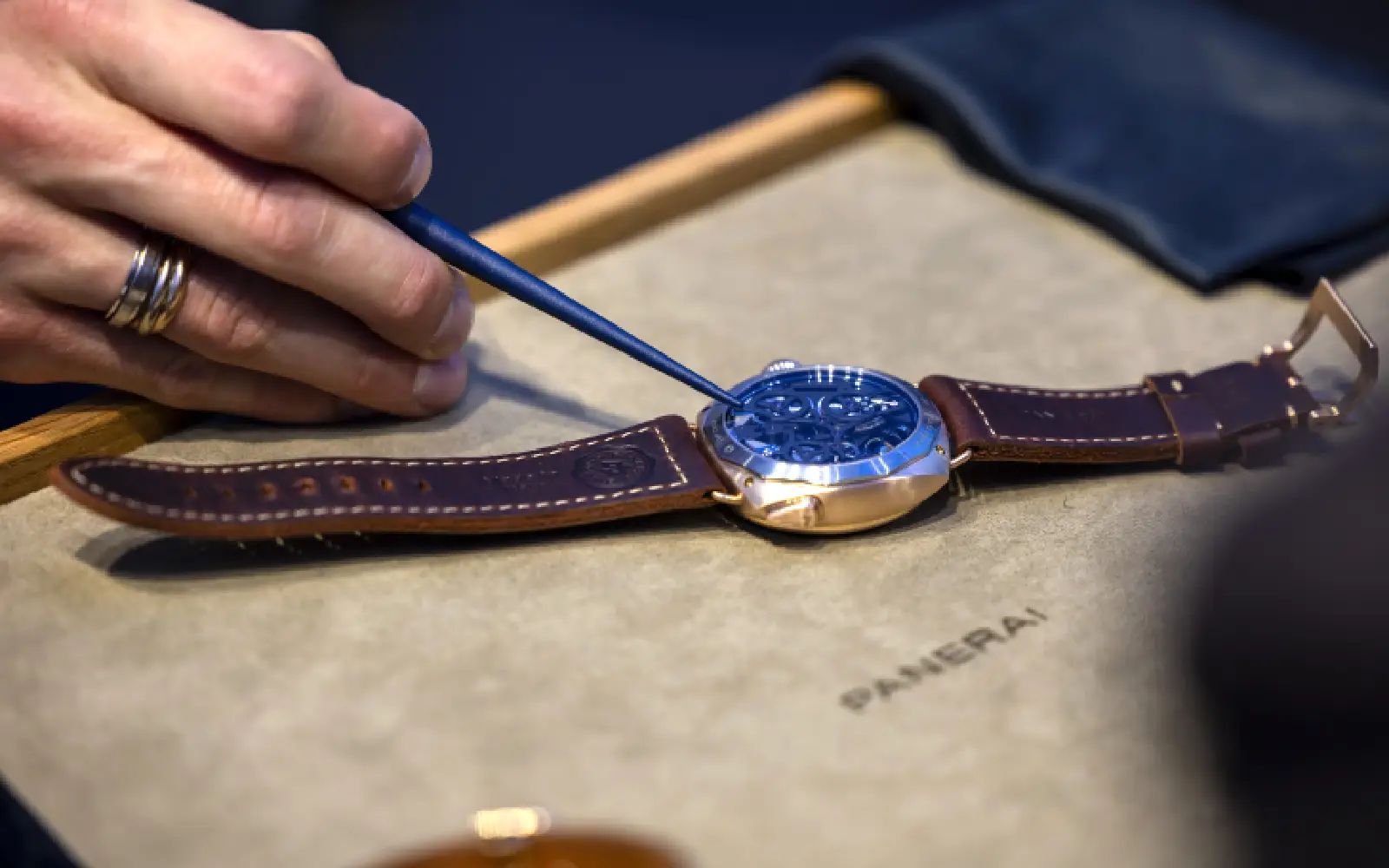 A person shows a Panerai wristwatch at the Italian watchmaker Panerai stand during the 'Watches and Wonders Geneva' luxury watch fair, in Geneva, Switzerland, 02 April 2025. EPA/SALVATORE DI NOLFI