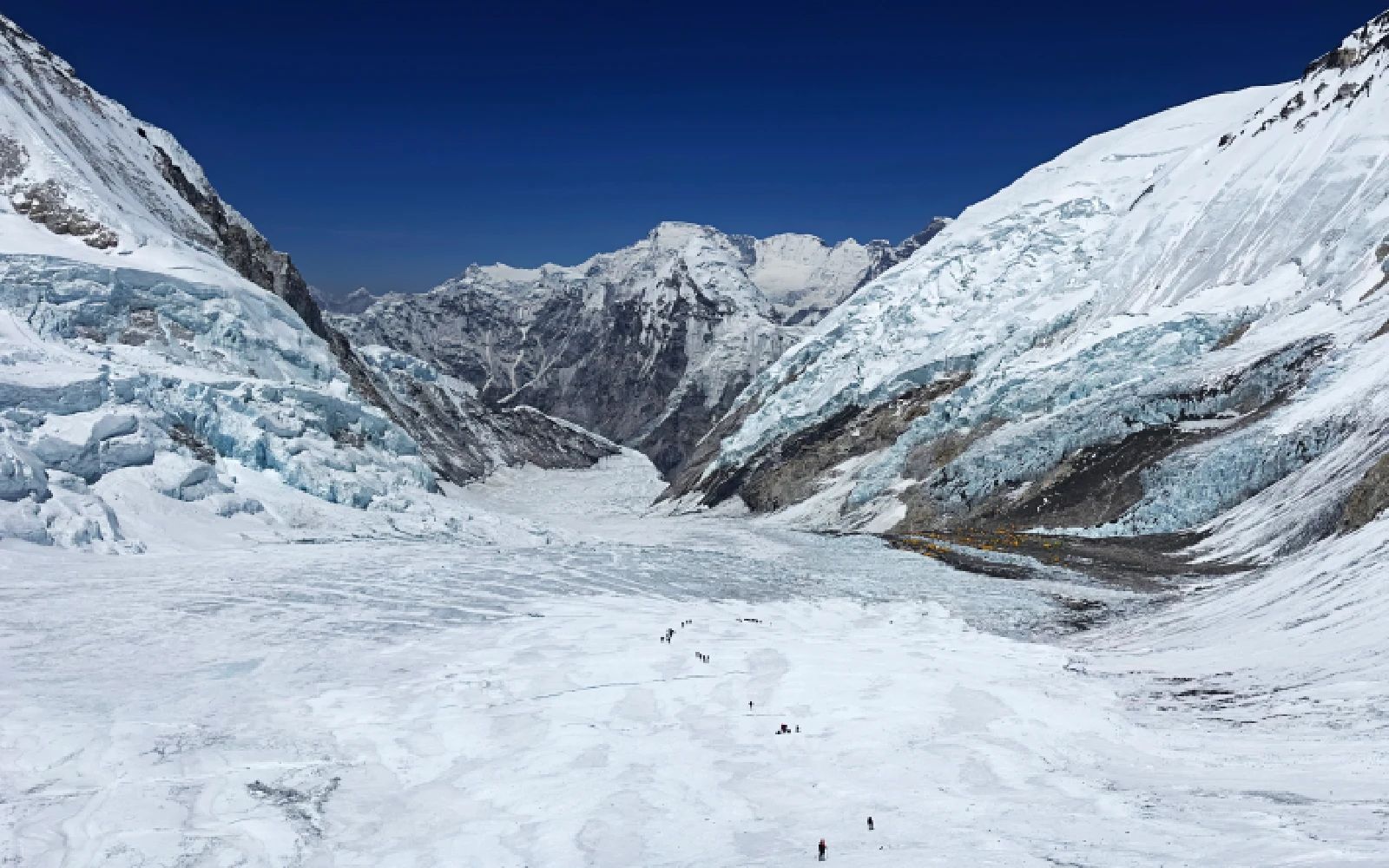 This photograph taken on May 3, 2024 shows mountaineers at the Khumbu Glacier during their ascend to Mount Everest's summit, in Nepal. A 54-year-old Nepalese climber known as "Everest Man" reached the peak of the world's highest mountain for a record 30th time on May 22, 2024, three decades after his first summit. Related c