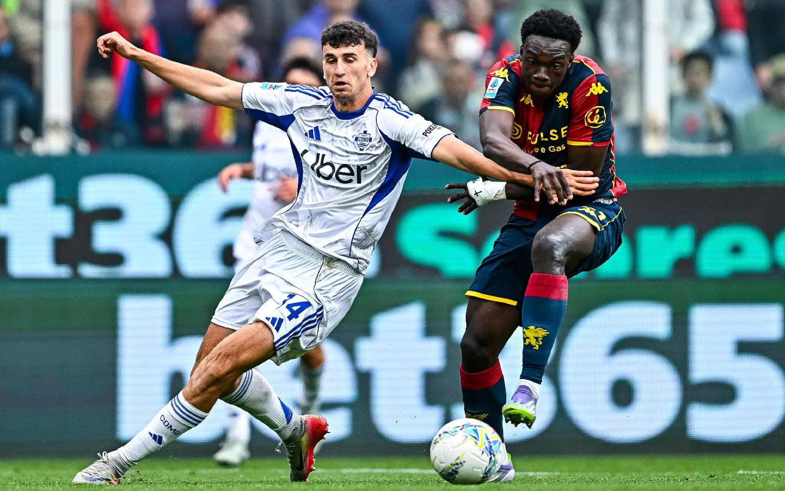 Como defender Jacobo Ramon (L) and Genoa forward Jeff Ekhator in action during the Italian Serie A match between Genoa CFC and Como 1907 at Luigi Ferraris Stadium in Genoa, Italy, 26 April 2026. EPA/Stringer