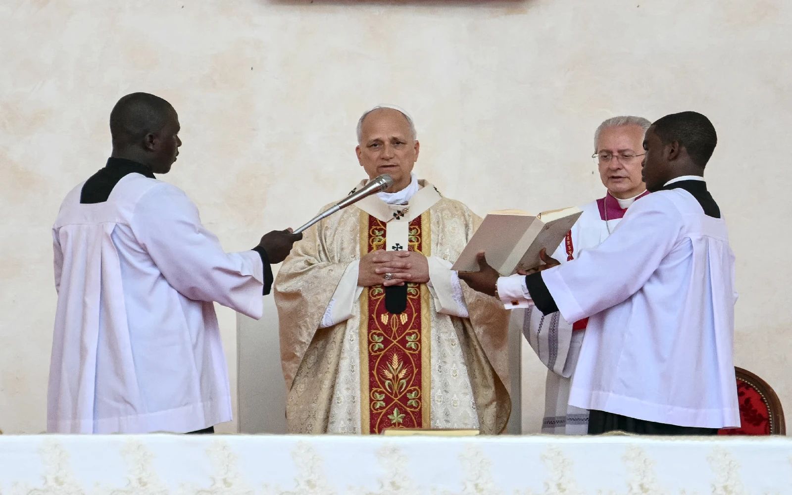 Pope Leo XIV (2nd L) leads a Holy Mass at the Malabo Stadium in Malabo on the last day of an 11-day apostolic journey to Africa, on April 23, 2026. (Photo by Alberto PIZZOLI / AFP)