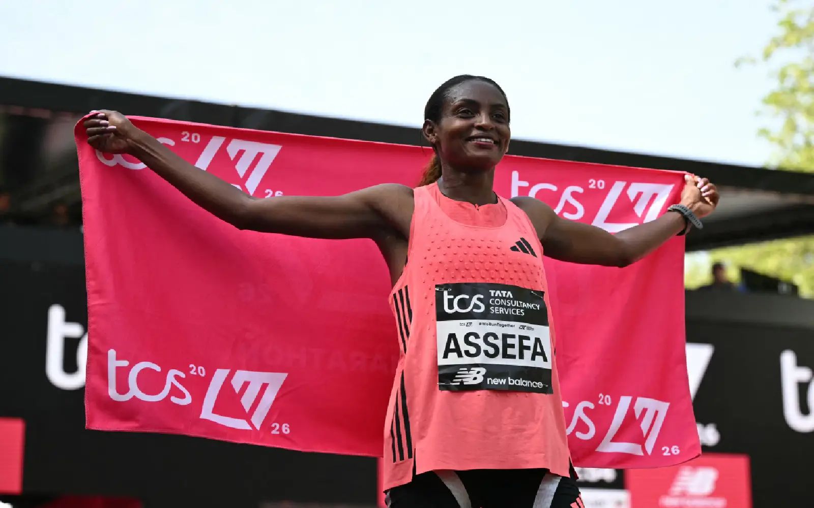 Ethiopia's Tigst Assefa poses after crossing the line to win the women's race in a new women's only world record at the 2026 London Marathon in central London on April