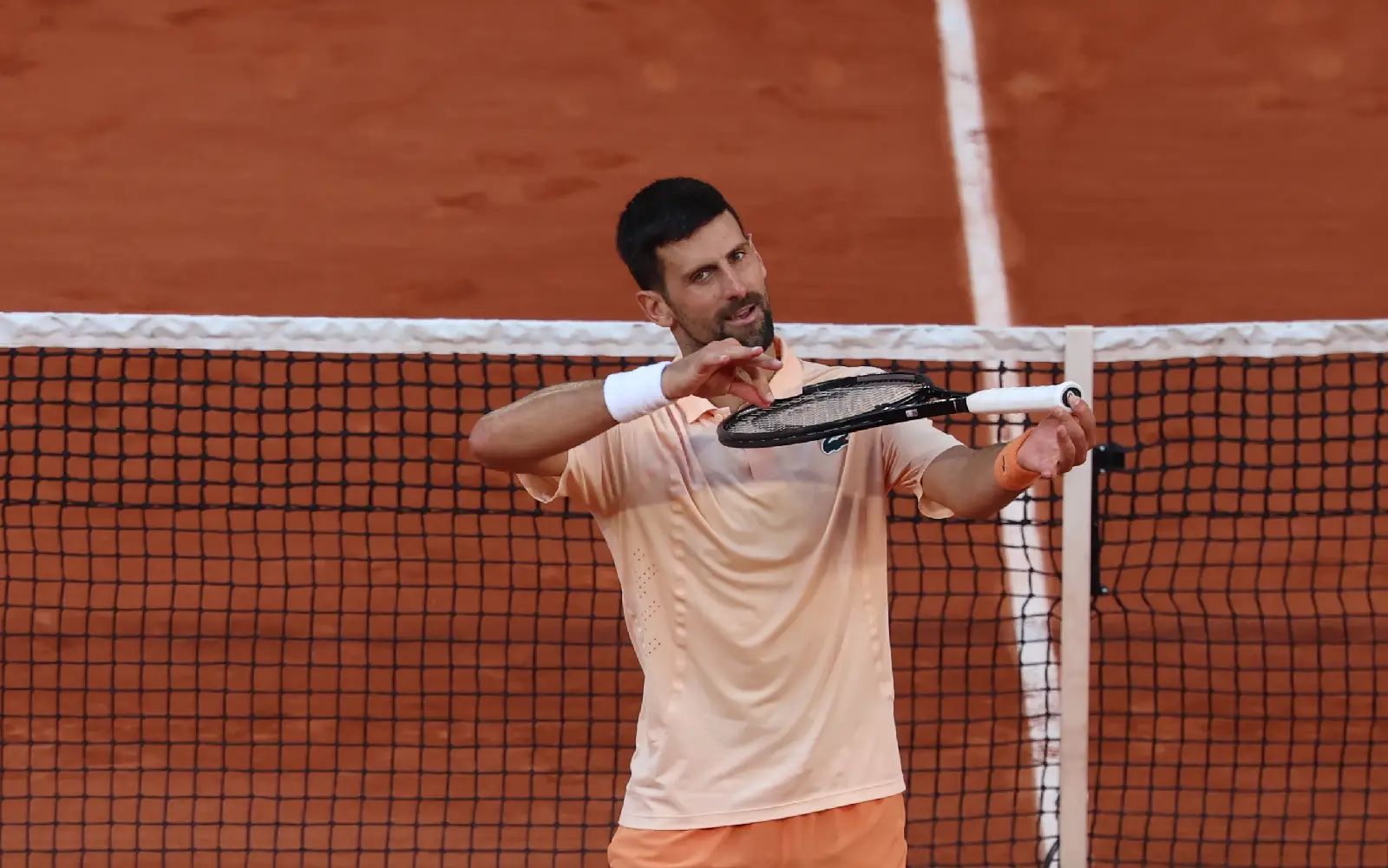 Novak Djokovic of Serbia celebrates winning against Valentin Royer of France in their Men's 2nd round match at the French Open Grand Slam tennis tournament at Roland Garros in Paris, France, 27