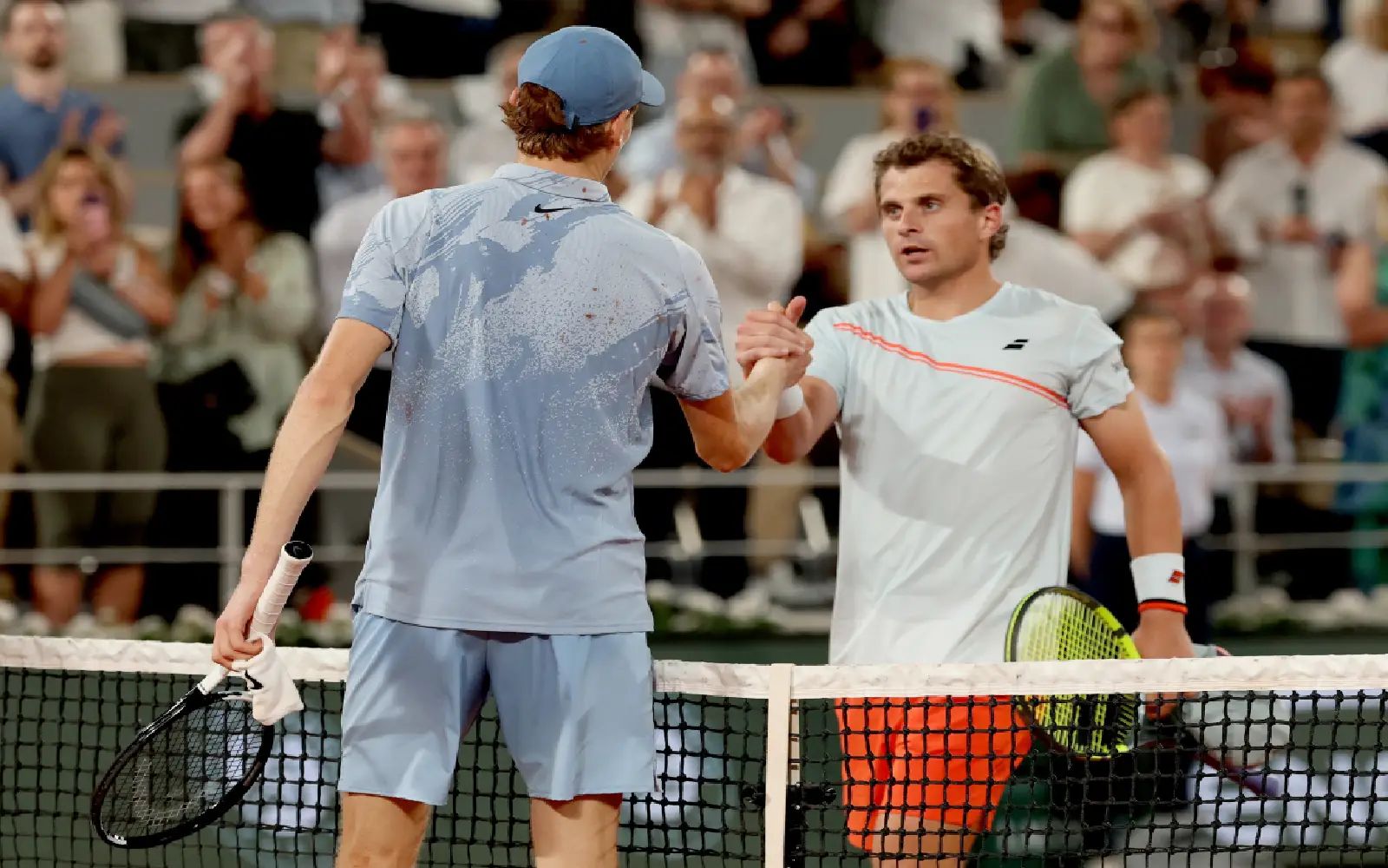 Jannik Sinner of Italy is congratulated by Clement Tabur (facing) of France after winning their Men's 1st round match at the French Open Grand Slam tennis tournament at Roland Garros in Paris, France, 26 May 2026. EPA/MOHAMMED BADRA