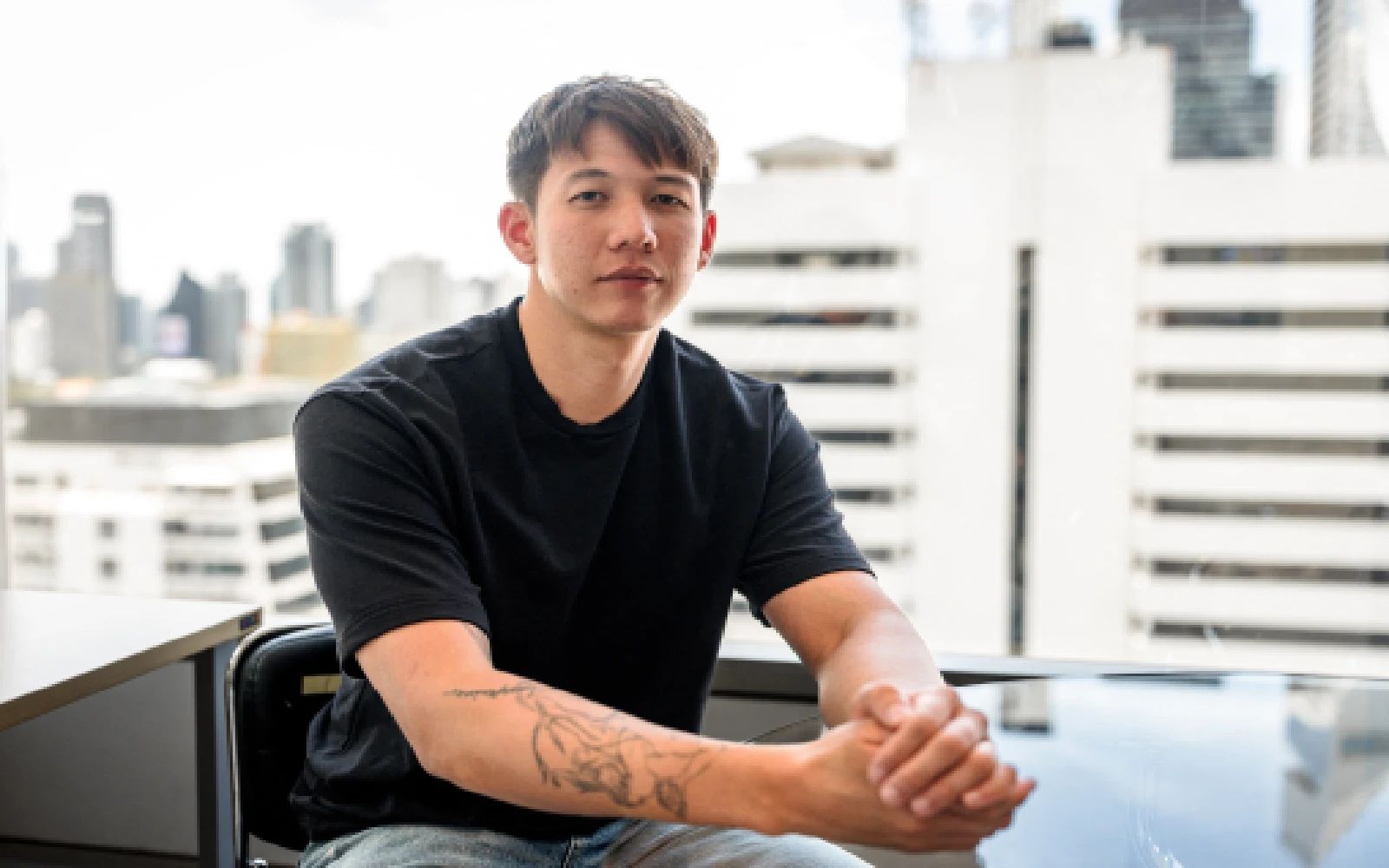 Siranudh "Psi" Scott, a fourth-generation member of the billionaire Thai family that founded the Singha beer brand, poses after an interview with AFP in Bangkok on May 24, 2026. A high-profile alleged sexual abuse case within a popular Thai beer family has prompted a rare public reckoning in the conservative kingdom, with other survivors using social media to speak out.