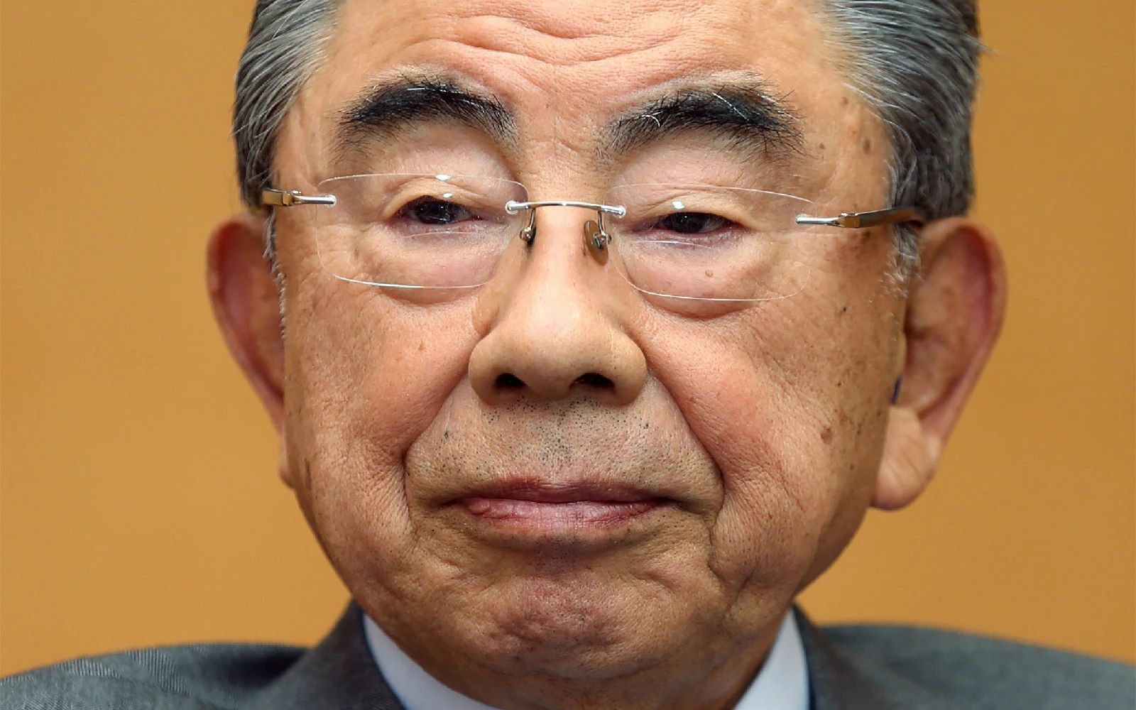 This picture taken on December 25, 2014 shows Seven & i Holdings Chairman and CEO Toshifumi Suzuki. Former chairman of Seven & i Holdings Toshifumi Suzuki, credited for the global success of 7-Eleven convenience stores, has died at the age of 93, the company said on May 25, 2026.