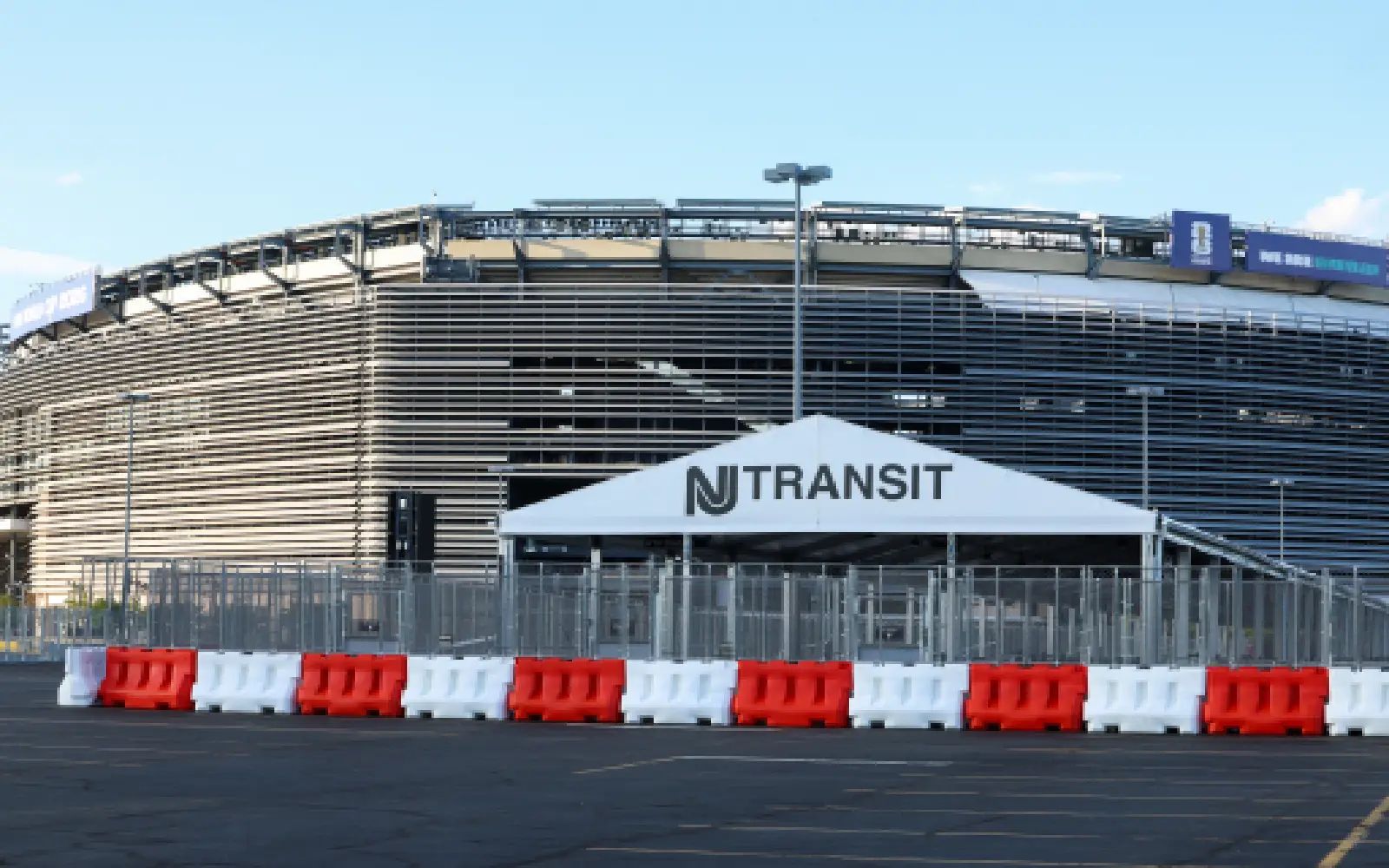 An under construction New Jersey Transit bus stop at New York New Jersey Stadium (temporarily renamed from MetLife Stadium for the 2026 FIFA World Cup) is seen in East Rutherford, New Jersey on May 7, 2026. The price of a roundtrip rail ticket from New York to the nearby stadium that will host the final and seven other matches at football's World Cup is being cut from $150 to $105, following outrage from fans, an official said Thursday.