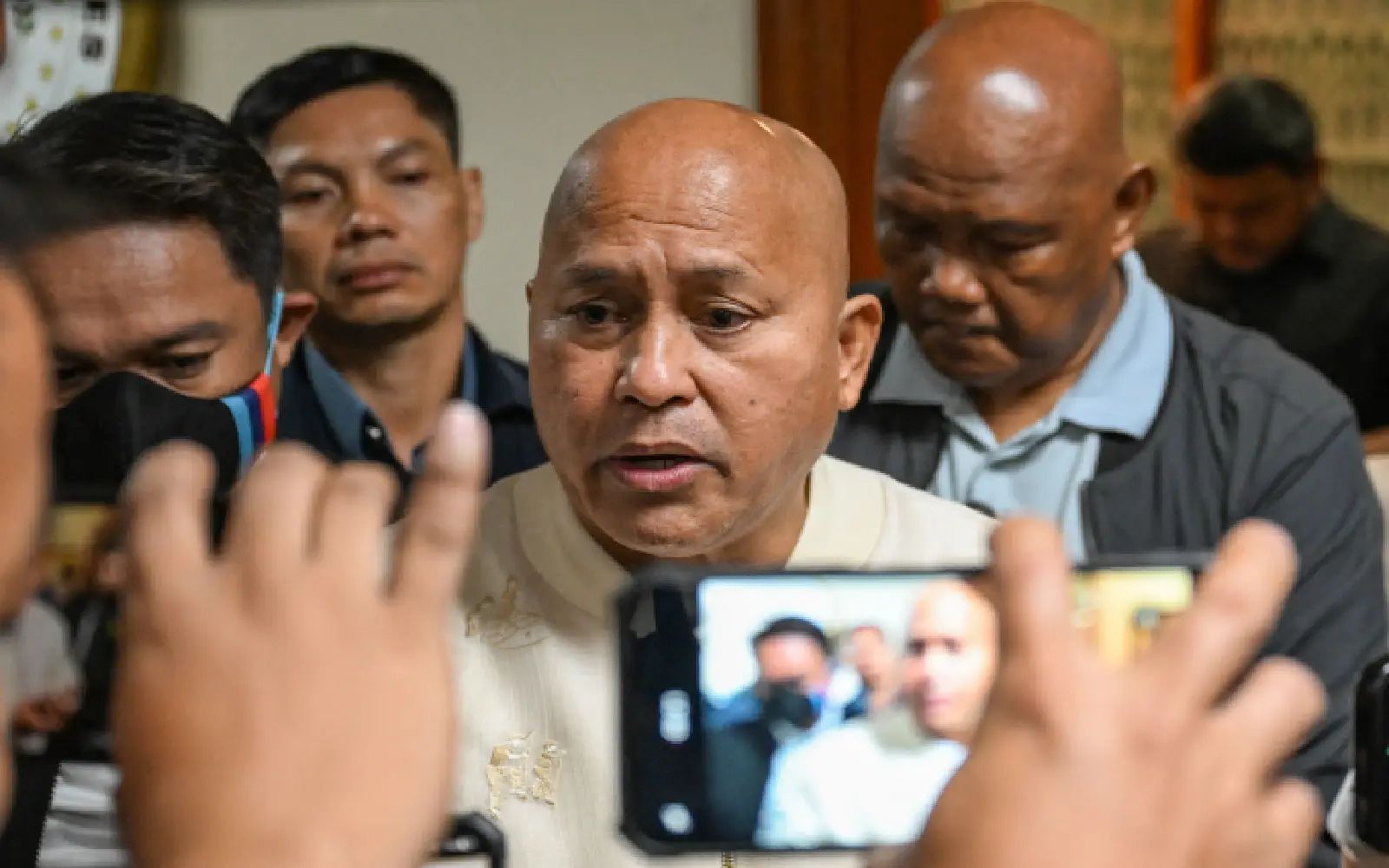Philippines Senator Ronald Dela Rosa talks to the media during a doorstop interview at the Senate of the Philippines in Pasay, Metro Manila on May 12, 2026. Philippine authorities said they would not arrest for now a lawmaker wanted by the International Criminal Court for his alleged role in ex-president Rodrigo Duterte's drug war, capping a lengthy Senate standoff.