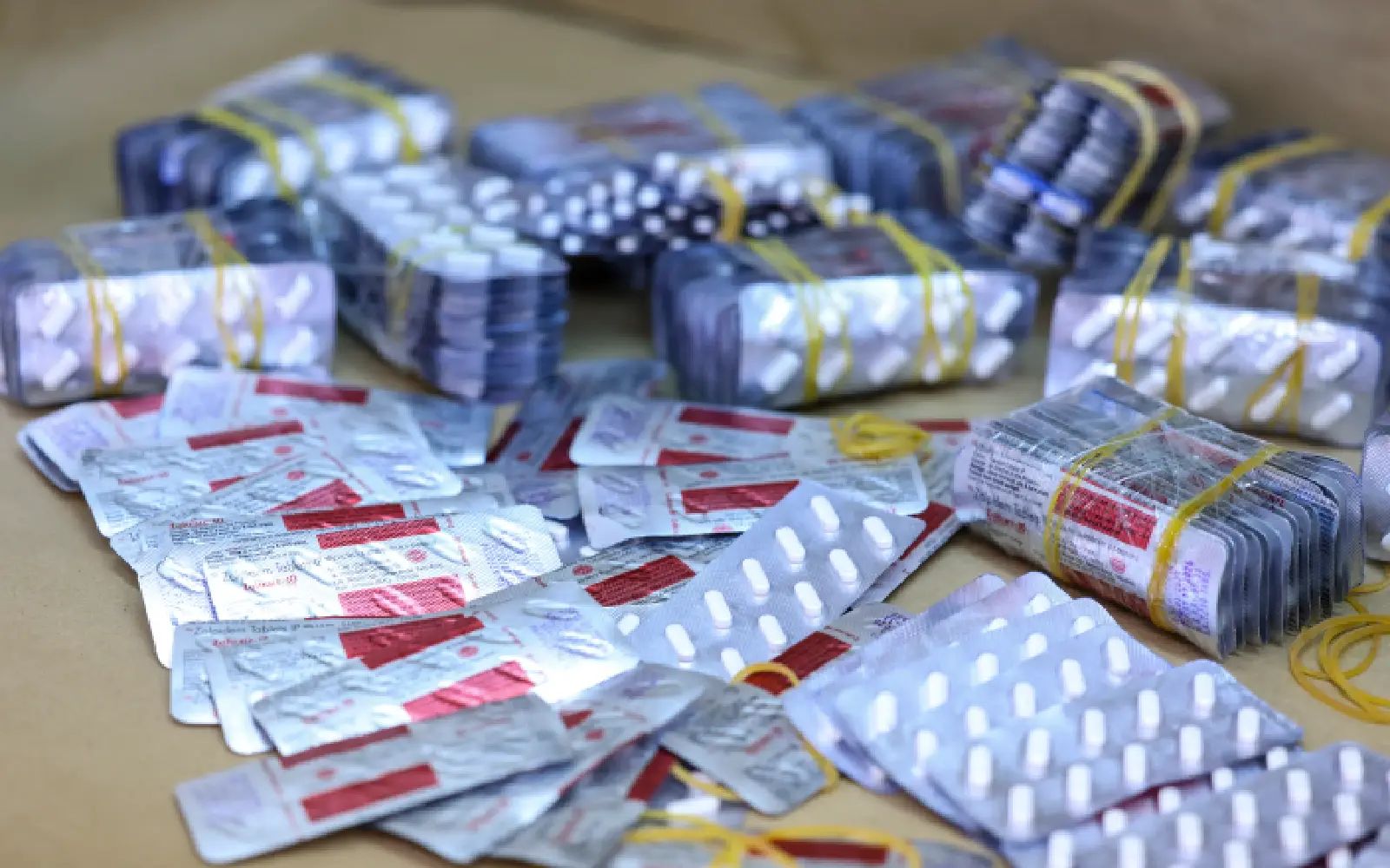 Pill blister packages believed to contain fentanyl are displayed at the Drug Enforcement Administration (DEA) Northeast Regional Laboratory for testing in New York, on May 7, 2026. (Photo by ANGELA WEISS / AFP)