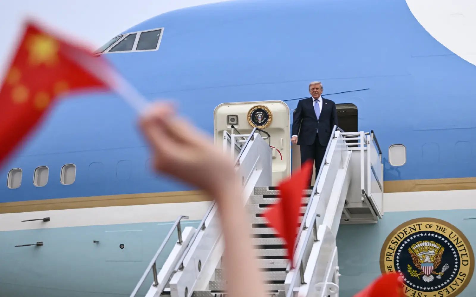 US President Donald Trump boards Air Force One before his departure from Beijing Capital Airport in Beijing on May 15, 2026. Trump said he had made "fantastic trade deals" with China's Xi Jinping, as the pair met on May 15 at final talks of a superpower summit that according to the US leader has also reaped a Chinese offer to help open the Strait of Hormuz.