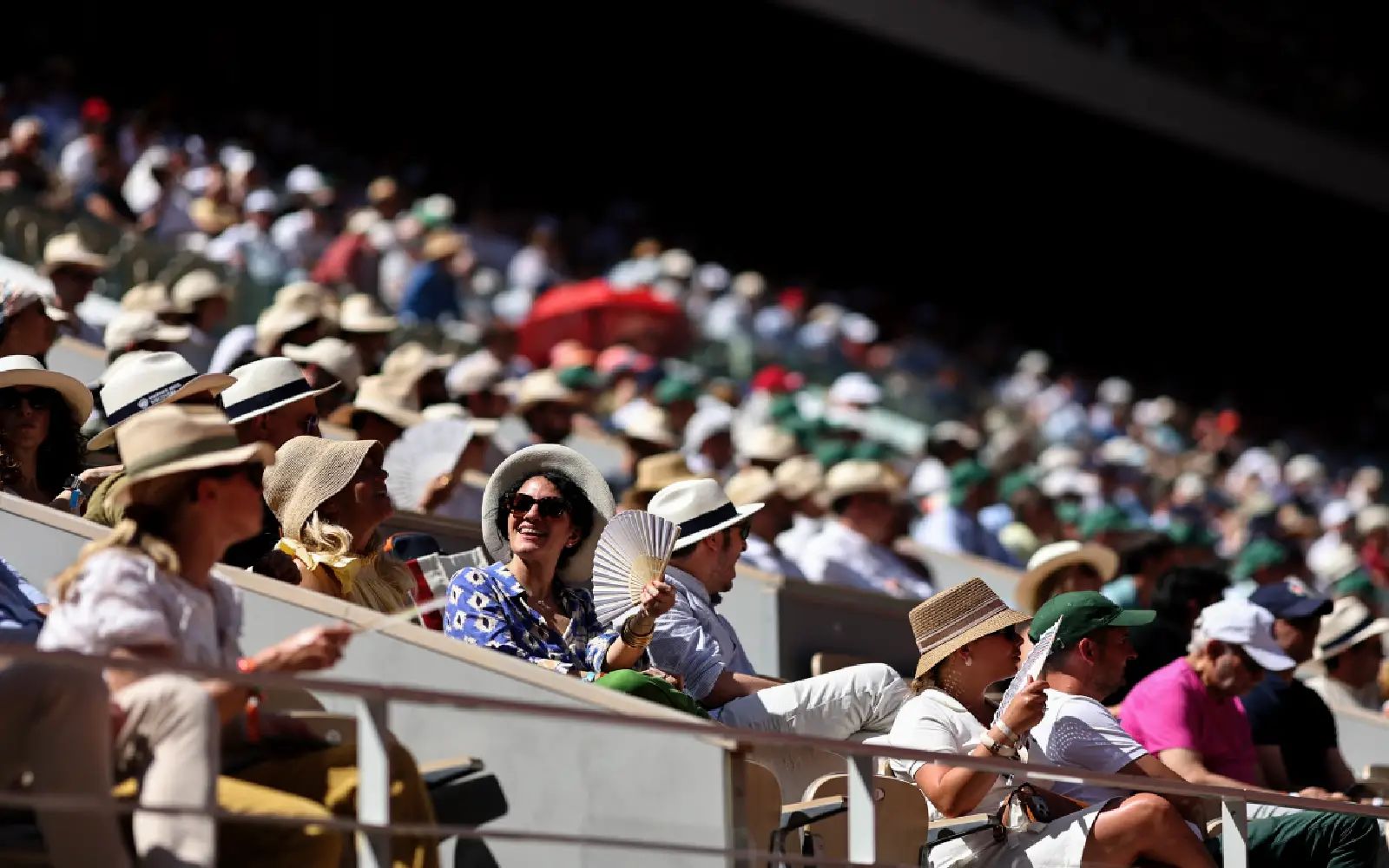 Spectators watch US Coco Gauff playing against US Taylor Townsend during their women's singles match on day 3 of the French Open tennis tournament on Court Philippe-Chatrier at the Roland-Garros Complex in Paris on May 26, 2026. (Photo by Anne-Christine POUJOULAT / AFP)