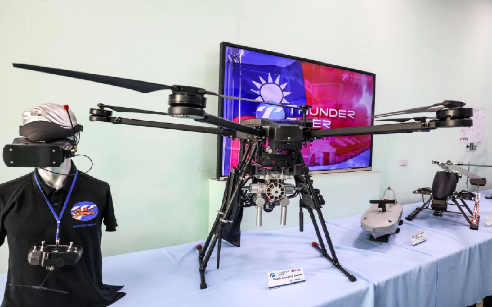 A bomb-dropping drone is displayed at the headquarters of Thunder Tiger Group in Taichung on April 21, 2026. Taiwan's drone exports are taking off, fuelled by the war in Ukraine, as Taiwanese companies seek a stake in the fast-growing global market for unmanned aerial vehicles.