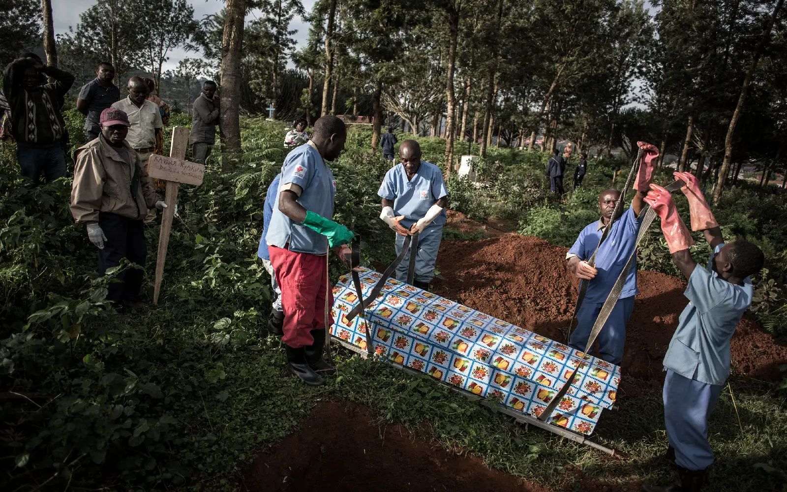 Health workers prepare to bury a coffin containing a victim of the ebola virus on May 16, 2019 in Butembo. An outbreak of the ebola virus has been blamed for dozens of deaths in the east of the Democratic Republic of the Congo, African health authorities said on May 15, 2026. The outbreak is in Ituri province.