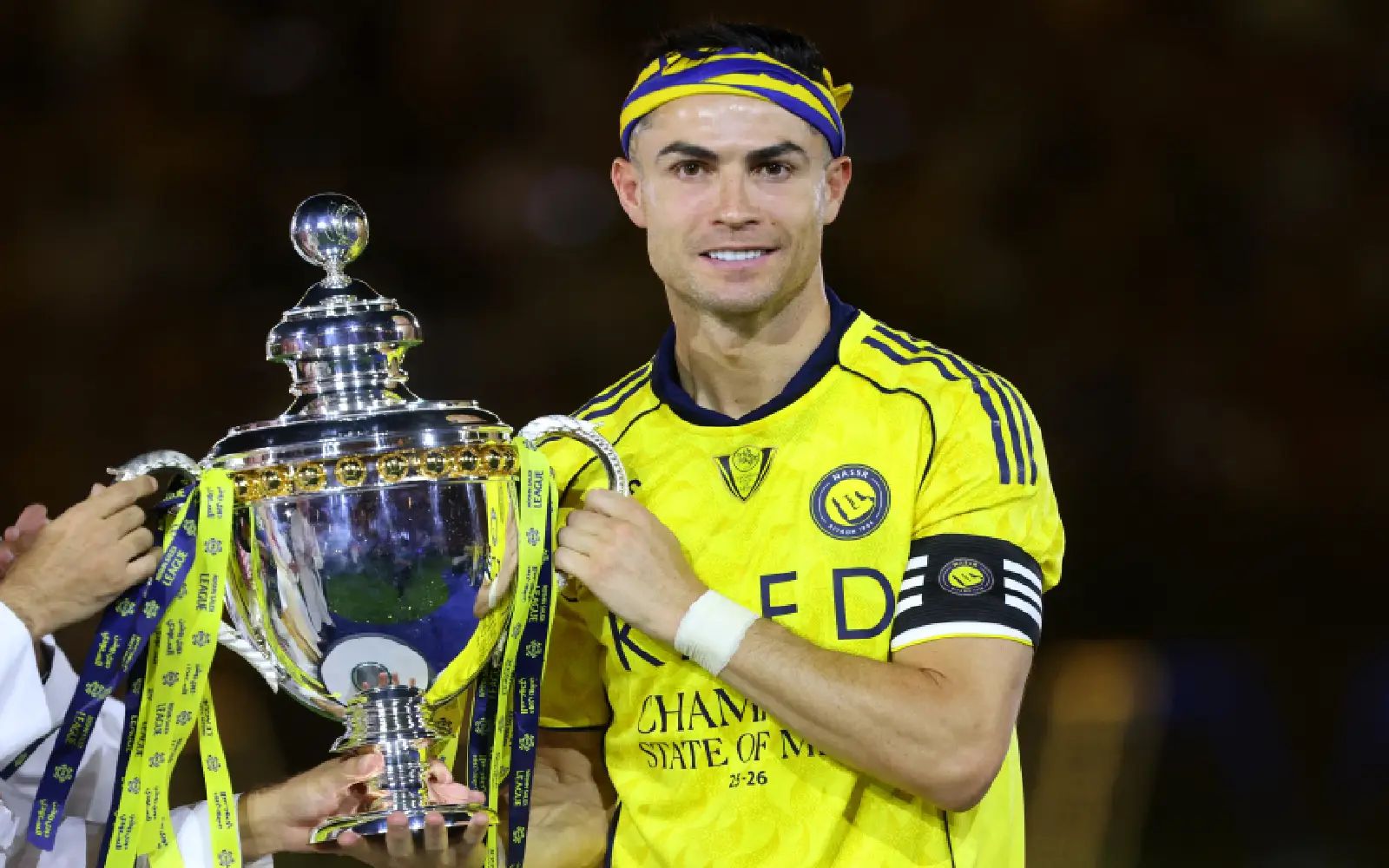 Nassr's Portuguese forward #07 Cristiano Ronaldo poses with the trophy after winning the Saudi Pro League title at the end of the football match against Damac at the Al-Awwal Park Stadium in Riyadh on May 21, 2026. (Photo by Fayez NURELDINE / AFP)