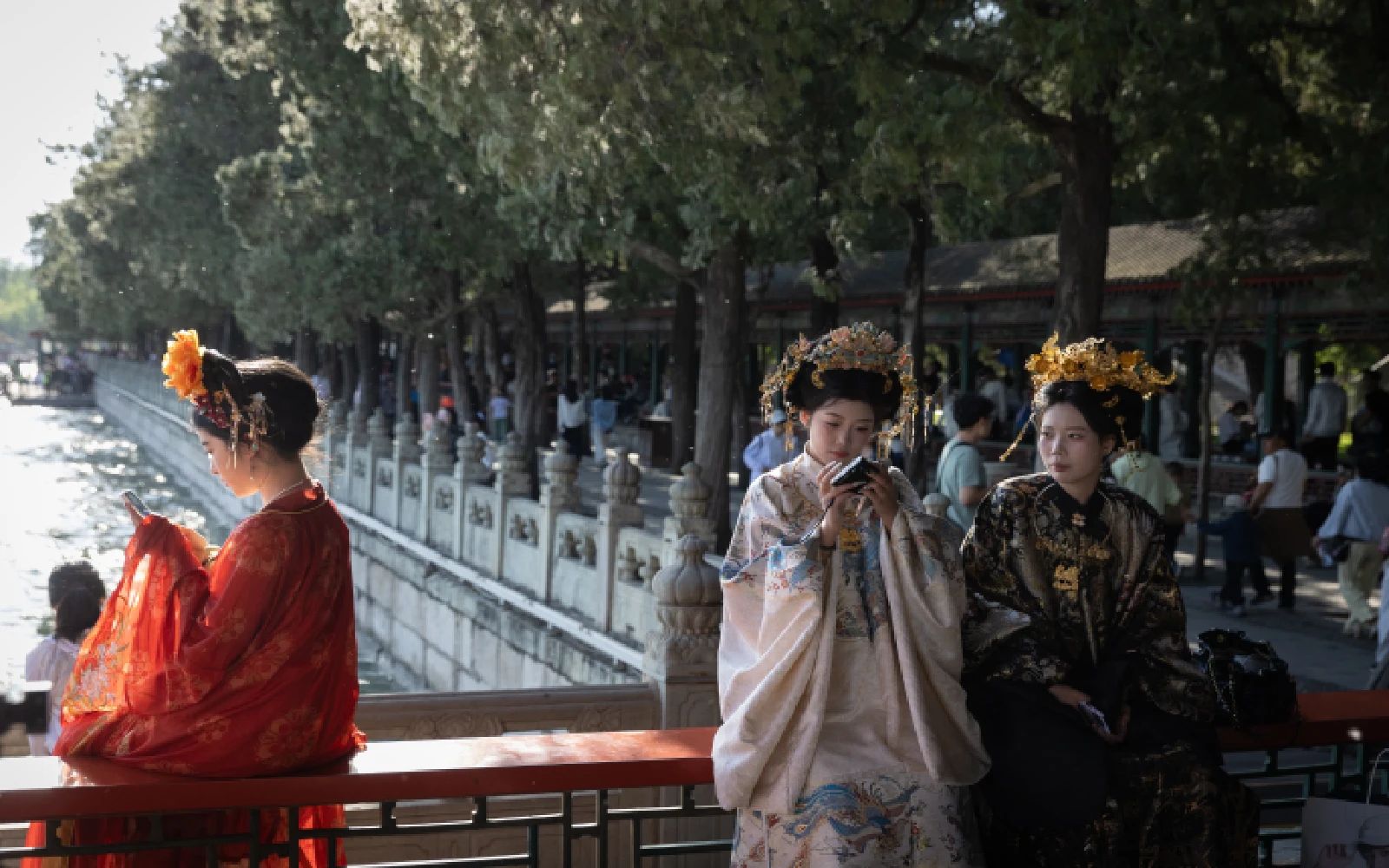 People dressed in traditional clothing sit at the Summer Palace in Beijing, China, 04 May 2026. The May Day holiday runs from 01 to 05 May. EPA