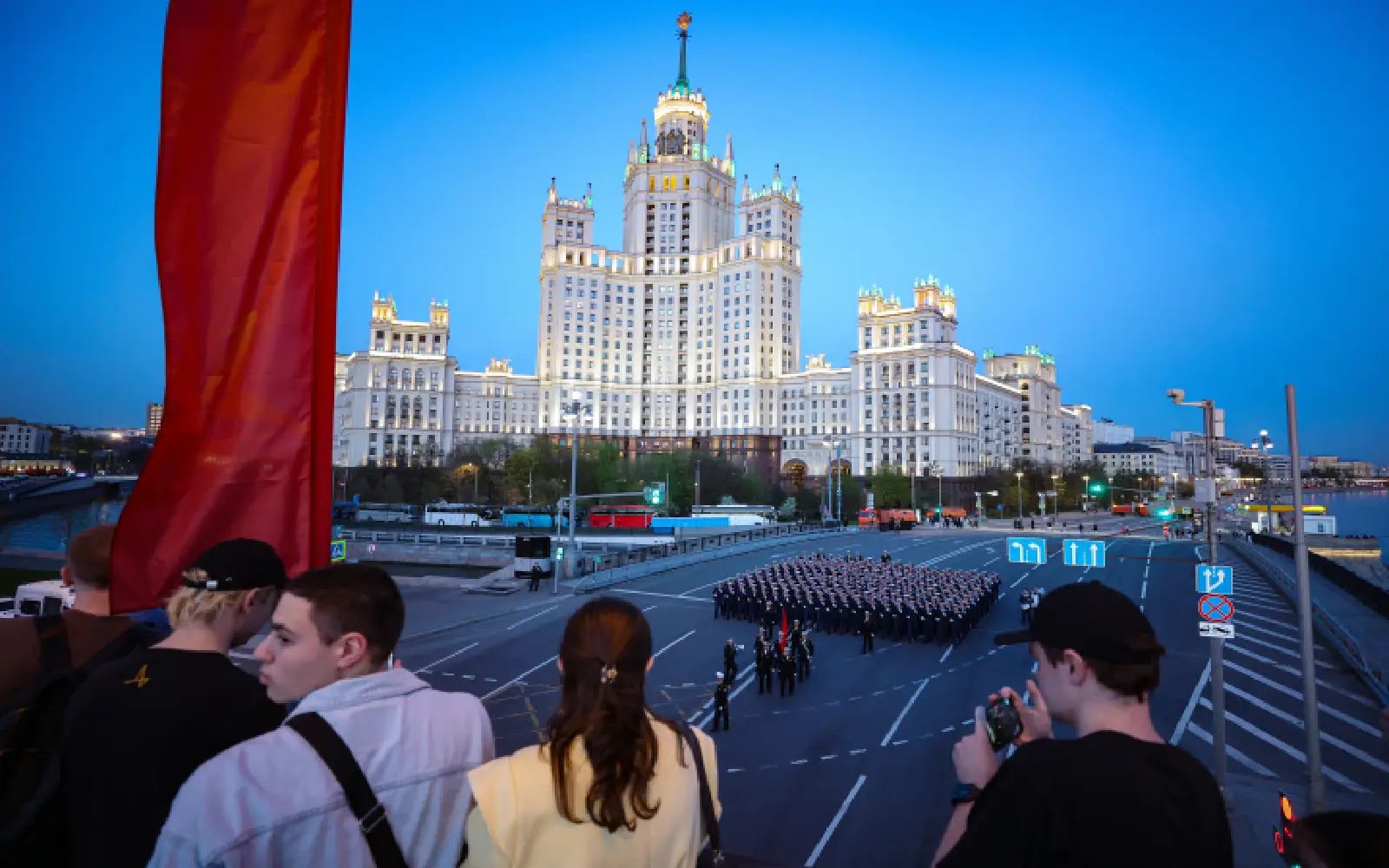 People watch as Russian servicemen march during preparations for a rehearsal of the annual military parade ahead of Victory Day celebrations in downtown Moscow, Russia, 04 May 2026. Russia is preparing to mark the 81st anniversary of Nazi Germany's unconditional surrender in World War II (WWII). A foot column of military personnel will take part in the Victory Day parade on Red Square. Due to the operational situation, military equipment will not be included. Suvorov and Nakhimov cadets will not participate in the parade this year, the Russian Ministry of Defense announced. EPA/MAXIM SHIPENKOV
