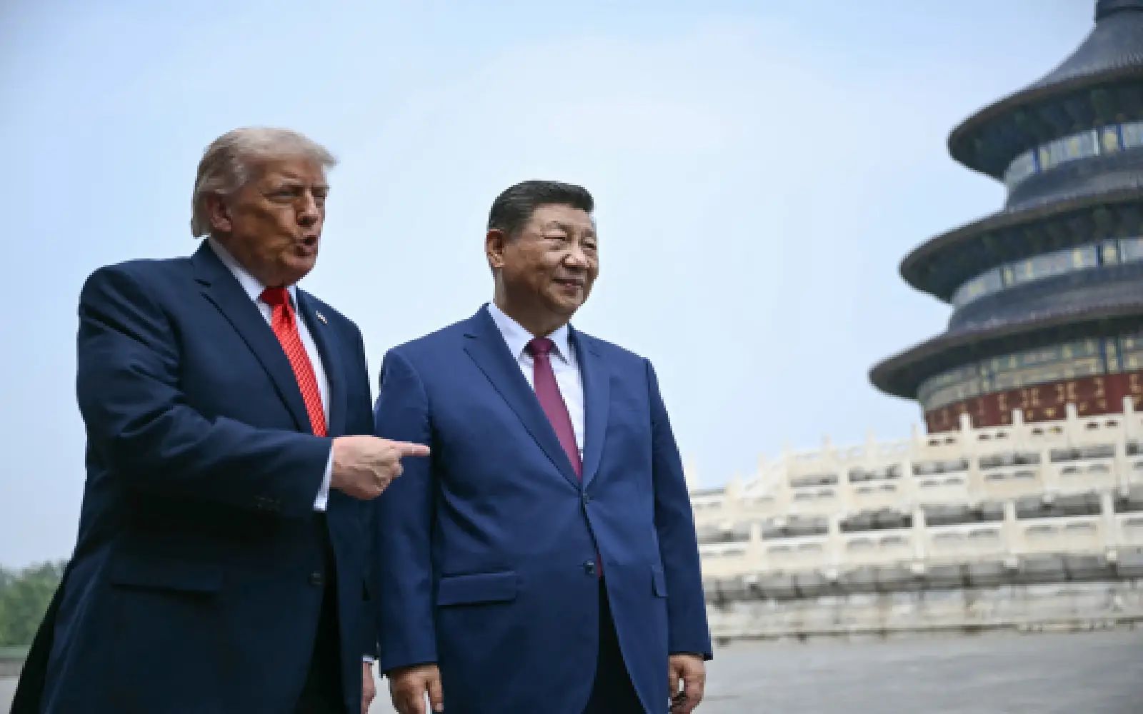 China's President Xi Jinping (R) and US President Donald Trump visit the Temple of Heaven in Beijing on May 14, 2026. Xi warned Trump that the issue of Taiwan could push their two countries into "conflict" if mishandled, a stark opening salvo as a superpower summit set to tackle numerous thorny issues began in Beijing on May 14.