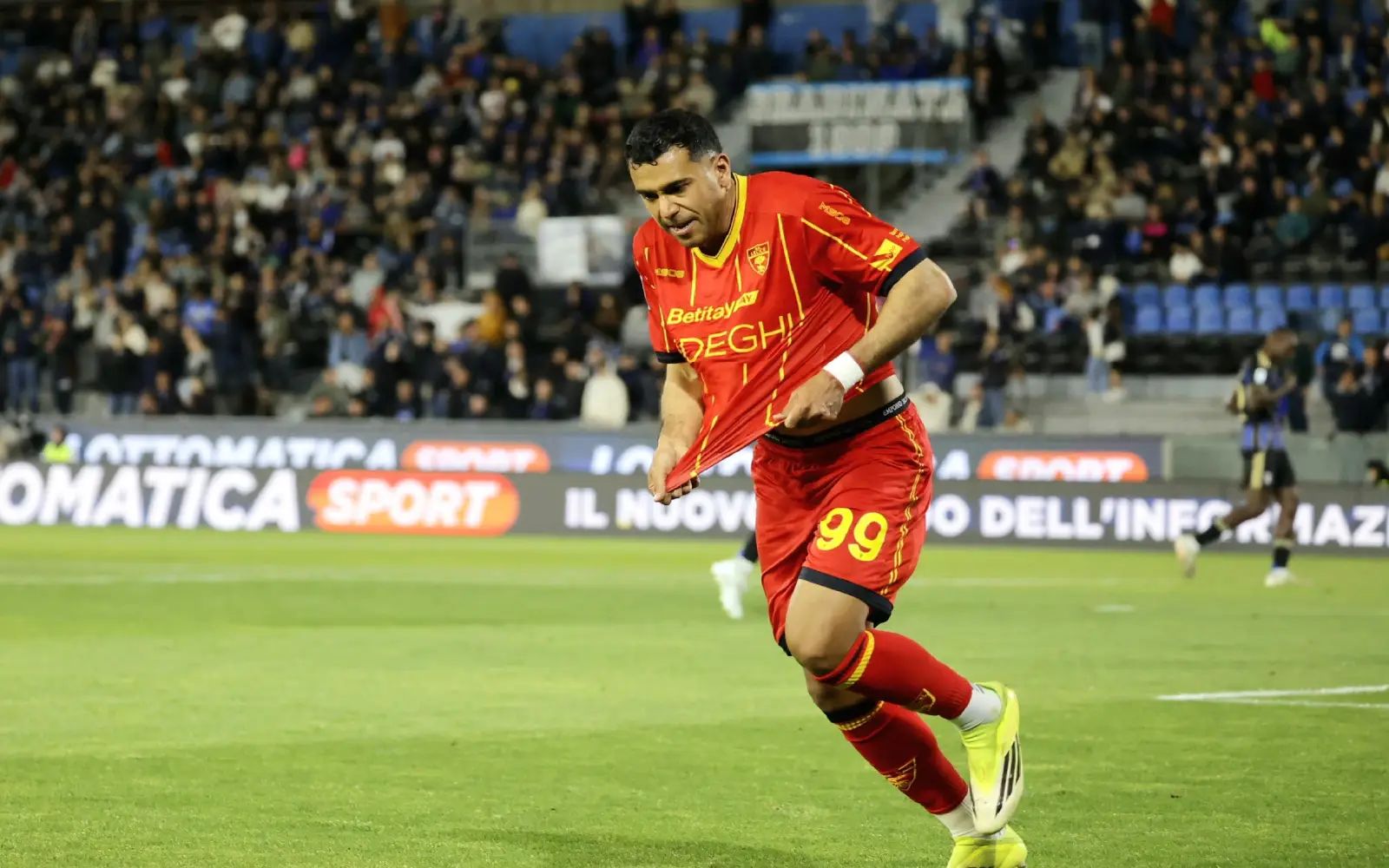 Lecce's Walid Cheddira celebrates after scoring the 1-2 goal during the Italian Serie A soccer match Pisa