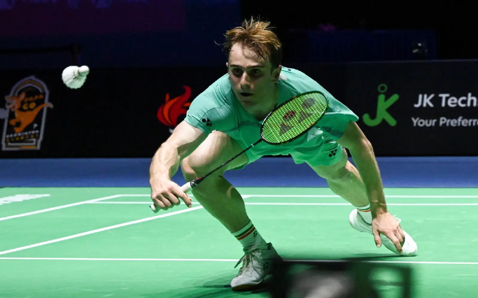 Alex Lanier of France hits a retun to Loh Kean Yew of Singapore during their men’s singles final match of the KFF Singapore Open Badminton tournament in Singapore on May 31, 2026.