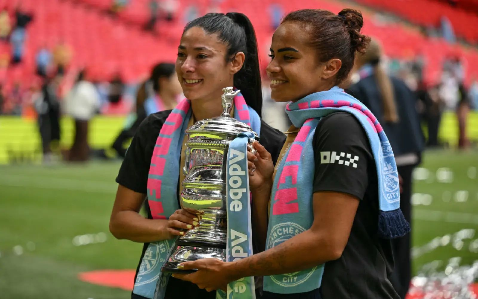 Manchester City's Australian striker #08 Mary Fowler (R) and Manchester City's Spanish defender #15 Leila Ouahabi (L) pose with the FA Cup during the presentation ceremony following the English Women's FA Cup final football match between Manchester City and Brighton and Hove Albion at Wembley Stadium in north west London on May 31, 2026. (Photo by Glyn KIRK / AFP)