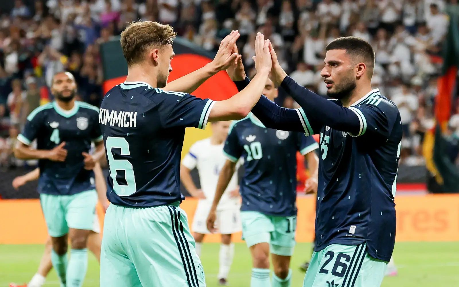 Deniz Undav (R) of Germany celebrates with teammate Joshua Kimmich after scoring the 1-0 goal during the friendly soccer match between Germany and Finland in Mainz, Germany, 31 May 2026. EPA/CHRISTOPHER NEUNDORF