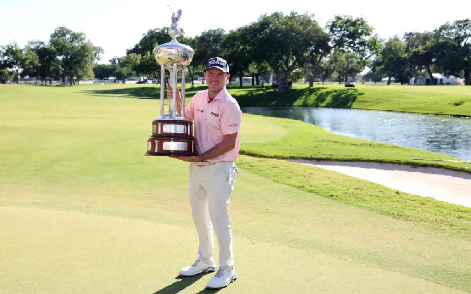 Russell Henley of the United States poses with the winner's trophy after winning the Charles Schwab Challenge 2026 at Colonial Country Club on May 31, 2026 in Fort Worth, Texas. Sam Hodde/Getty Images/AFP (Photo by Sam Hodde / GETTY IMAGES NORTH AMERICA / Getty Images via AFP)
