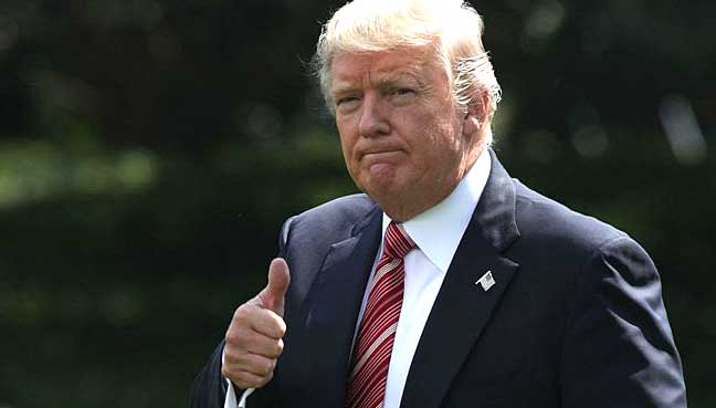 Trump signs memo banning transgender troops