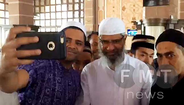 Wanted in India, Naik set to rebuild empire in friendly Malaysia