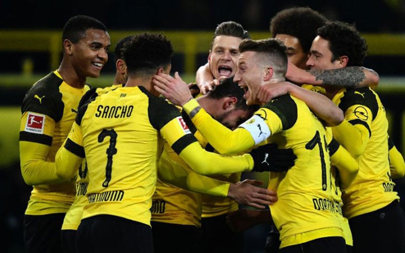 Dortmund edge Bremen to stay unbeaten and increase lead