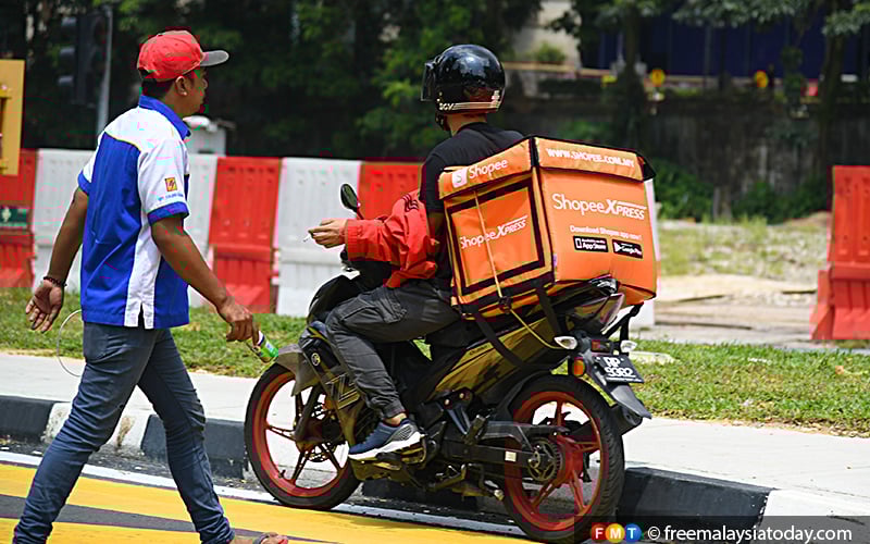 Give employee rights to e-hailing and delivery workers, says Umno Youth