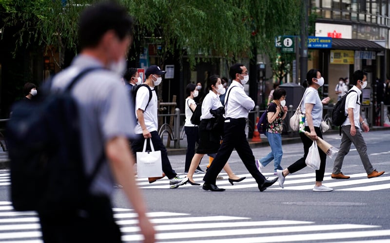 Japan to lift virus ban on re-entry of foreign residents
