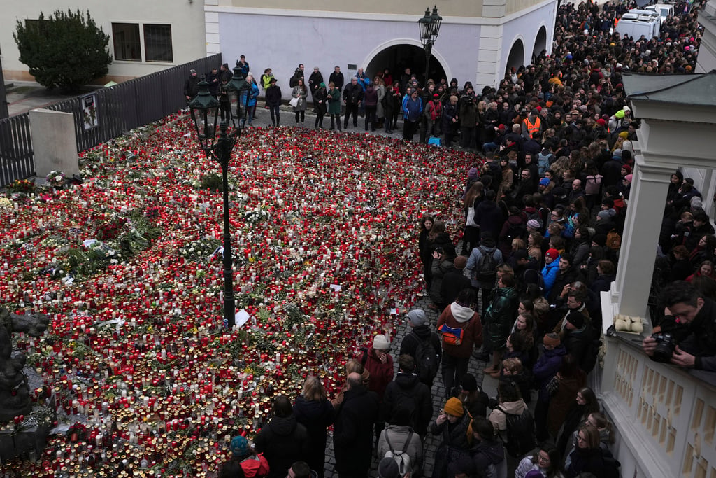 Mourners march, hold mass hug to remember Prague shooting victims