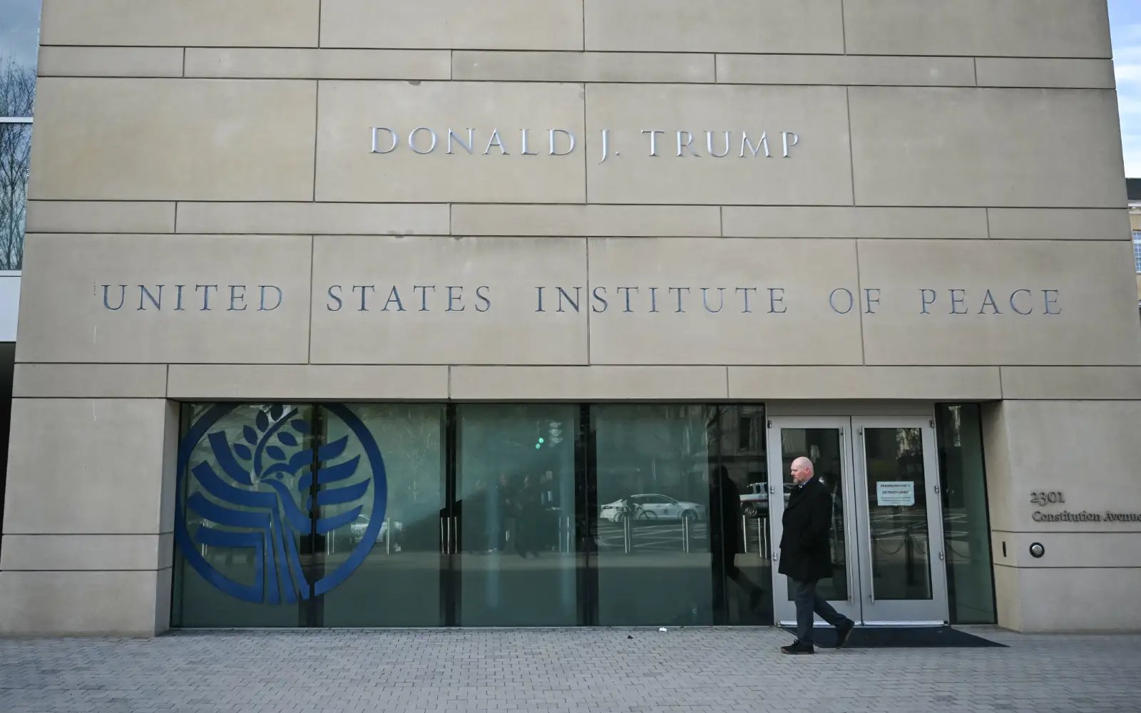 Trump revels in peace institute renamed after himself