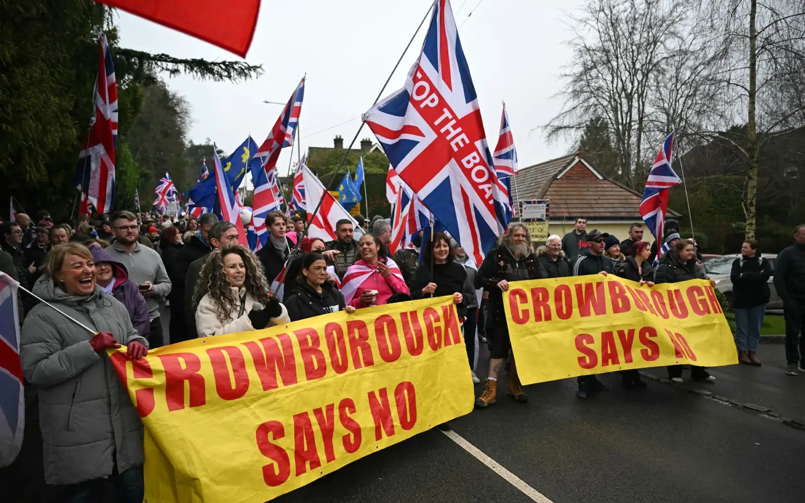 Hundreds protest use of military barracks to house asylum seekers in UK