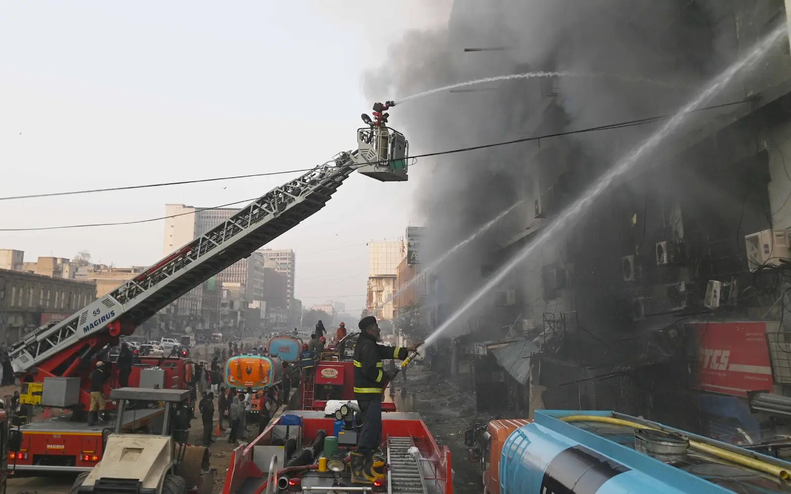 Dozens missing after massive Karachi mall fire, 14 killed