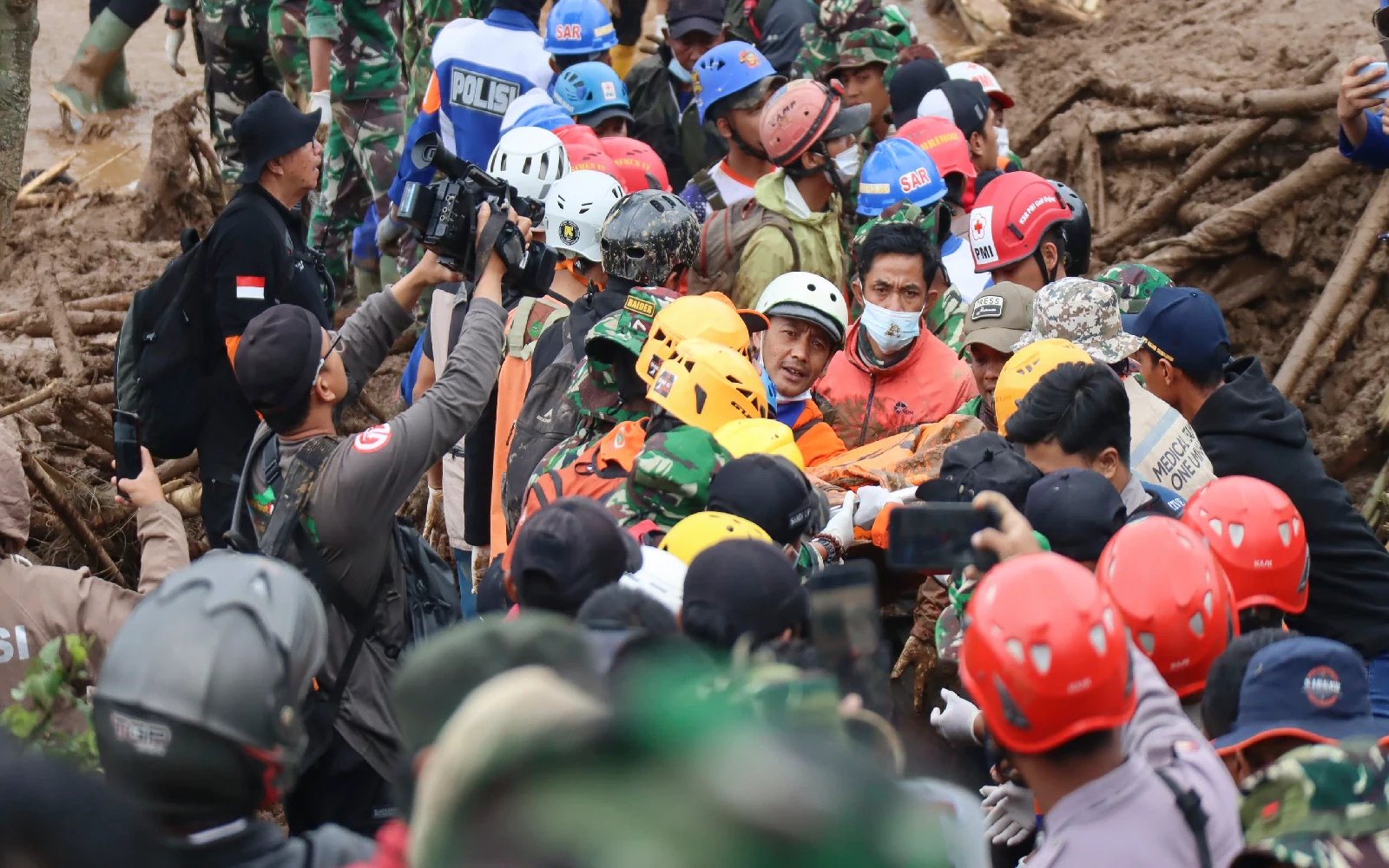 Search for 32 people missing in Indonesia after landslide hampered by rain as death toll climbs to 34