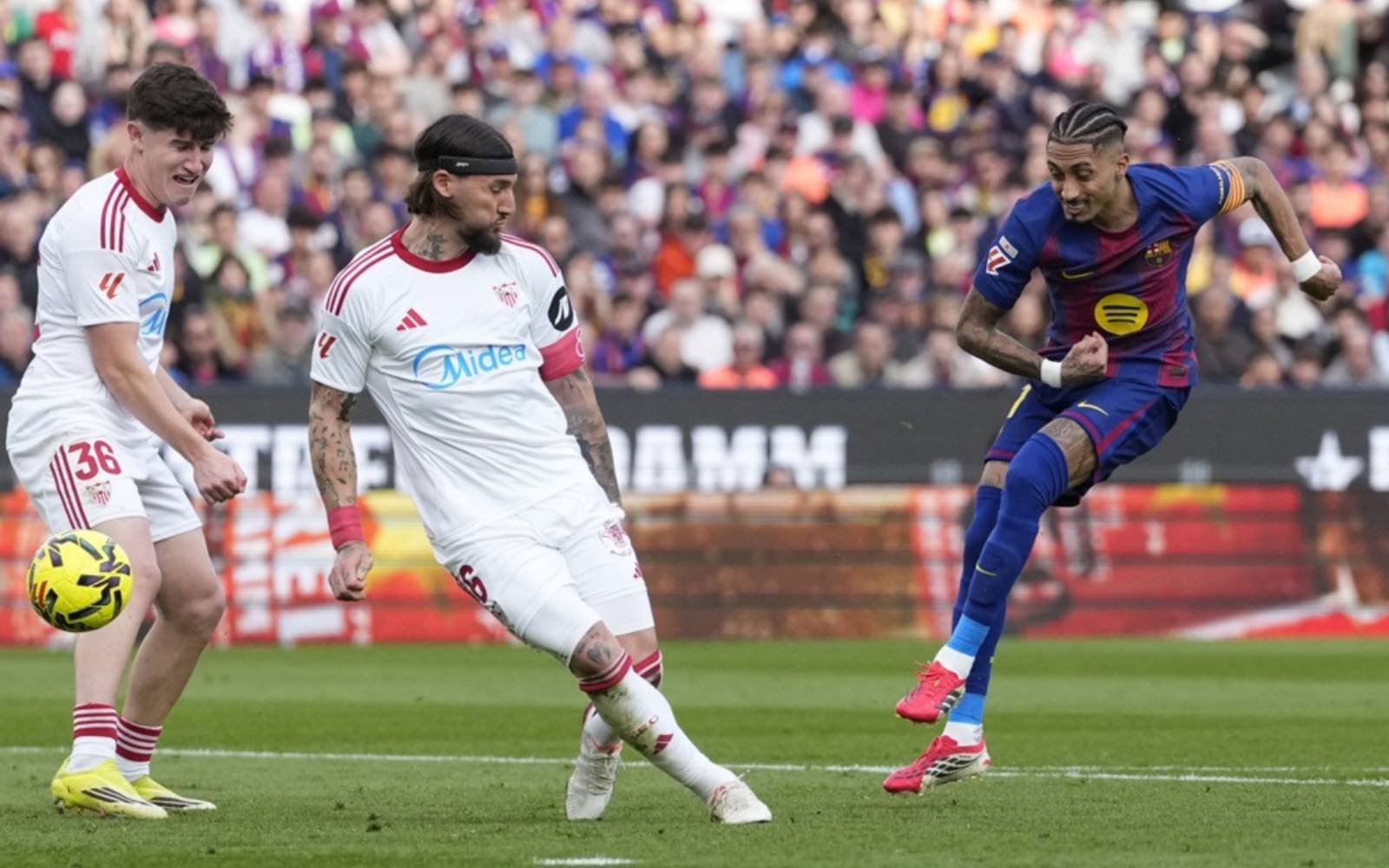 Raphinha hits treble as La Liga leaders Barca thrash Sevilla